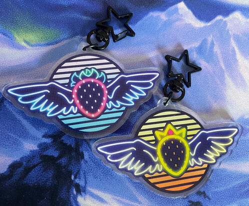 A neon redesign of a winged strawberry item from the game Celeste