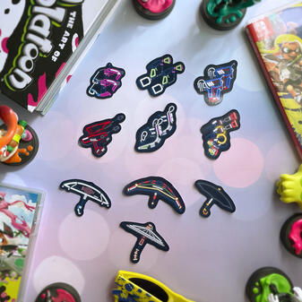 Sticker designs based off of weapons from the game Splatoon